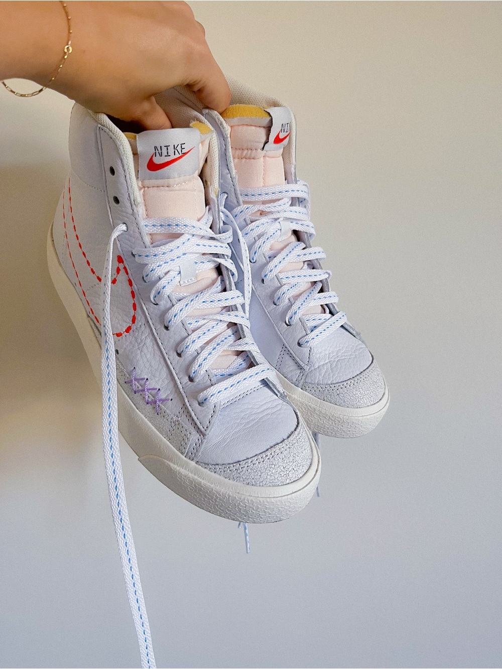 Nike Women's White High-Top Sneakers with Pink Tongue and Orange Swoosh